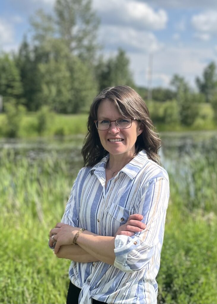 “Tammy Dyck, DCHM, RHN, CCHM graduate and homeopath, smiling